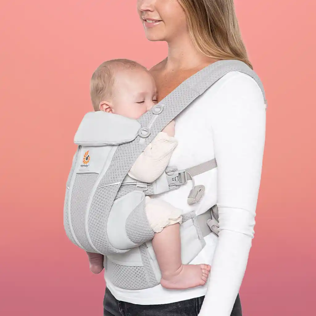 The Ergobaby Omni Breeze Baby Carrier features breathable mesh for all-season comfort and six versatile carrying positions, accommodating babies from 7 lbs to 45 lbs.