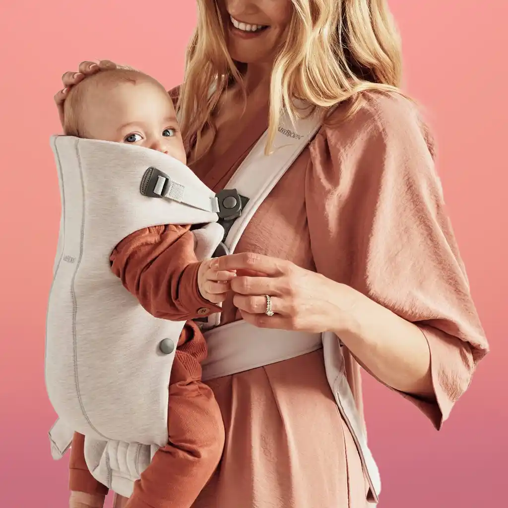 The BabyBjorn Baby Carrier Mini is perfect for newborns with its soft, snug design and easy-to-use buckles, supporting babies from 7 lbs to 24 lbs.