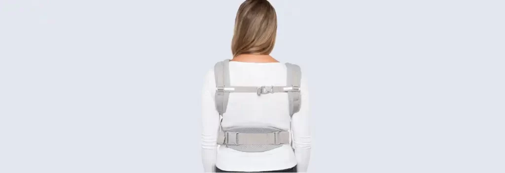 Ergobaby Omni Breeze Baby Carrier with padded shoulder straps and lumbar support for caregiver comfort.