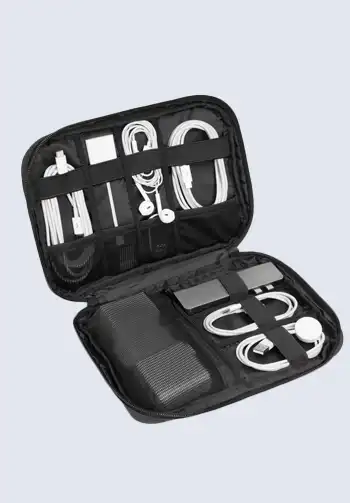 A sleek black compact travel cord organizer, perfect for neatly storing and organizing all your essential chargers and cables for easy access during travel.