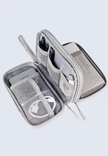 A portable grey cord organizer pouch, ideal for carrying various chargers and cables, ensuring they stay organized and easy to find in your travel bag.