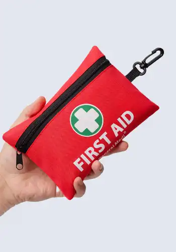 A portable travel first aid kit, perfect for keeping essential medical items organized and accessible during your journey.