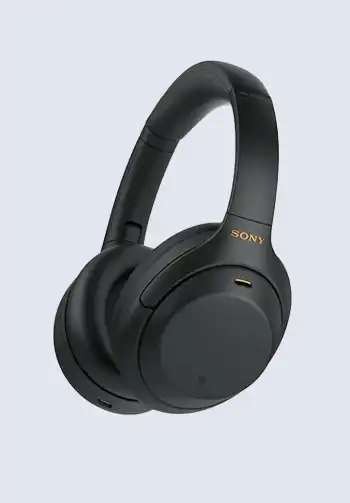 A pair of over-ear noise-cancelling headphones in sleek black, offering superior sound quality and comfort for long flights and noisy environments.