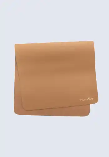 Leather portable changing pads in tan color, providing a stylish and easy-to-clean surface for diaper changes, suitable for keeping in your diaper bag.