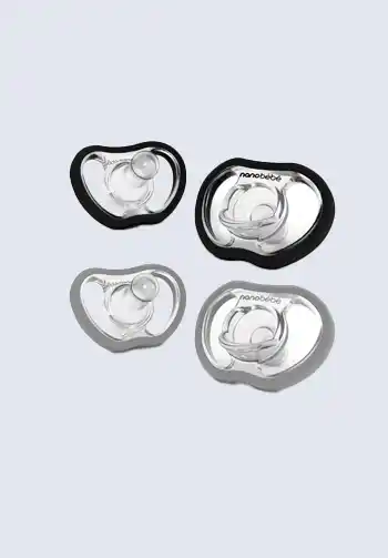 A set of black and clear pacifiers, designed for comfort and orthodontic support, ideal for your diaper bag.