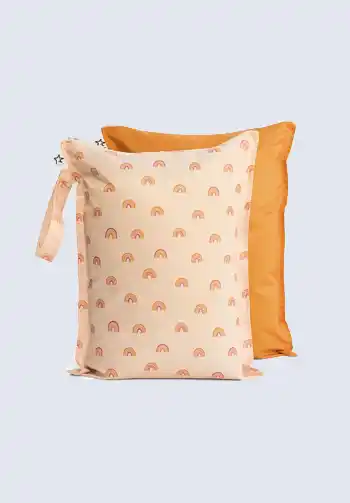 A set of two waterproof wet bags, one with a rainbow pattern and one in solid orange, designed to keep soiled clothes or cloth diapers separate in your diaper bag.