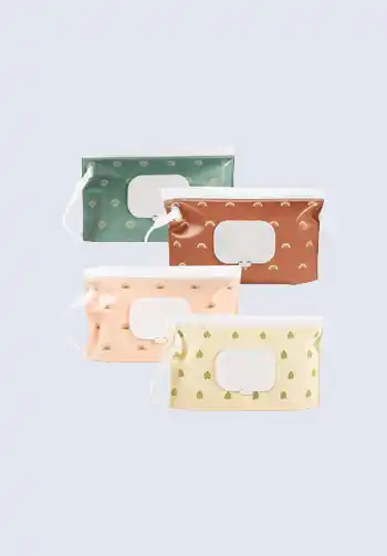 A set of four portable wipes dispensers with various patterns, designed to keep wipes fresh and accessible in your diaper bag.