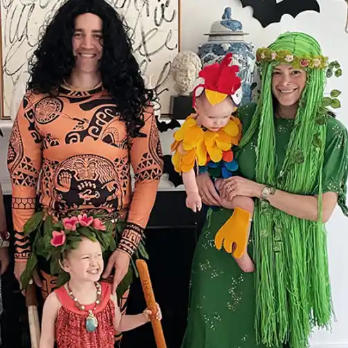 A creative family costume set with members dressed as Moana, Maui, Te Fiti, and Hei Hei, showcasing a fun and cohesive Moana theme.