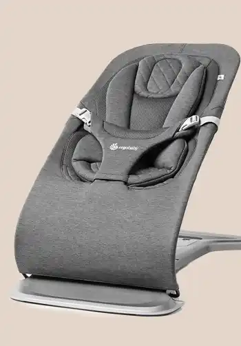 Ergobaby 3-in-1 Evolve Bouncer in a stylish charcoal grey knit fabric, offering a cozy and modern look.