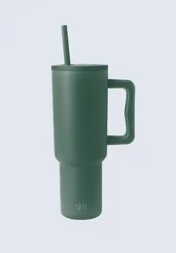 A green Simple Modern tumbler with a straw, providing convenient hydration, an essential item for a hospital bag list for birth to ensure continuous fluid intake.