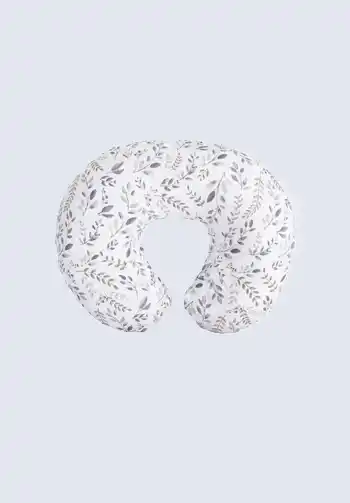 A floral nursing pillow, providing support and comfort for breastfeeding. A must-have item on your hospital bag checklist.