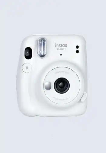 A white Fujifilm Instax Mini 11 instant camera, perfect for immediate photo prints to capture first moments, essential for a hospital bag for labor.