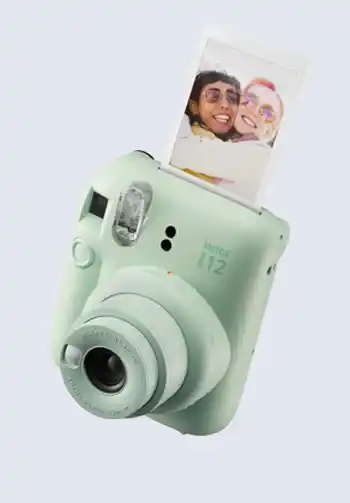 A mint green Fujifilm Instax Mini 9 instant camera, providing quick and easy photo prints, making it a necessary addition to a hospital bag for delivery list.