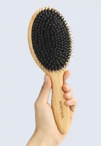 A Bestool boar bristle hair brush, perfect for keeping hair tangle-free and smooth, a must-have for a hospital bag for mom.