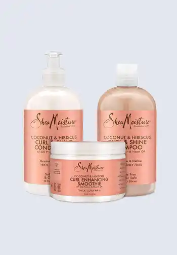 A set of SheaMoisture Coconut & Hibiscus shampoo, conditioner, and curl enhancing smoothie, ideal for maintaining curly hair during hospital stays, essential for a hospital bag for labor.