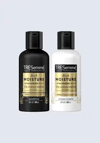 Bottles of TRESemmé Rich Moisture shampoo and conditioner, providing hydration and nourishment for hair, a must-have for a hospital bag for mom.