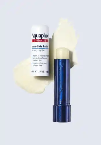 An Aquaphor Lip Repair stick, ideal for healing and protecting dry lips during hospital stays, making it a necessary item for a hospital bag for delivery list.