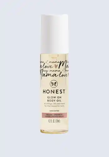 A bottle of Honest Glow On body oil, providing natural hydration and a calming scent, a must-have for a hospital bag for mom to promote relaxation during labor.