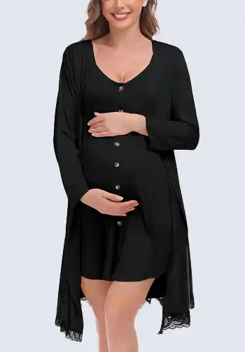 A pregnant woman wearing a black, button-down nightgown, an essential item for a hospital bag for mom, providing easy access for breastfeeding and postpartum comfort.