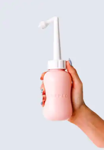 A perineal cleansing bottle, ideal for postpartum hygiene and comfort, making it a necessary addition to a hospital bag for delivery list.