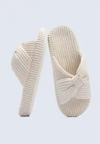 A pair of striped slippers with a bow knot design, essential for including in a hospital bag list for birth, offering cozy comfort for hospital stays.