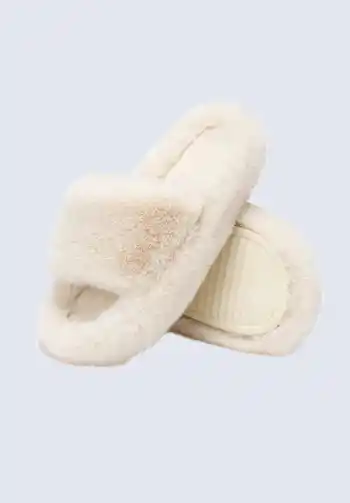 A pair of plush, furry slippers, a must-have for a hospital bag for delivery list, providing luxurious comfort and warmth for postpartum recovery.