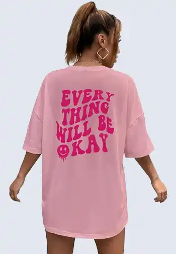 This pink oversized graphic tee is perfect for a casual soccer mom outfit. Featuring a positive message, it adds a fun and relaxed vibe to your look. Pair it with denim shorts or leggings for a comfortable and stylish sideline attire.