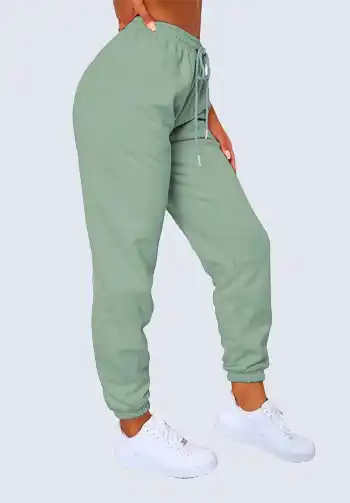 Add a touch of color to your soccer mom wear with these sage green high-waisted joggers. Their relaxed fit and drawstring waist provide both comfort and style. Match them with a cozy sweatshirt and white sneakers for an effortlessly chic look.