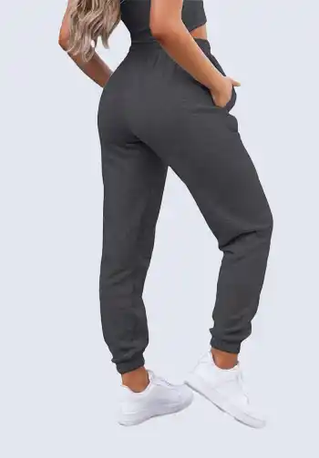 These charcoal gray high-waisted joggers are perfect for a versatile and stylish soccer mom outfit. Their neutral color makes them easy to pair with any top, ensuring you stay comfortable and fashionable. Ideal for an active day cheering from the sidelines.