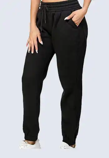 These classic black drawstring joggers are an essential piece for any soccer mom's wardrobe. The high-waisted design and adjustable drawstring offer a customizable fit, making them perfect for a sporty chic look. Pair them with a zip-up hoodie and athletic sneakers for a practical and stylish soccer mom attire.