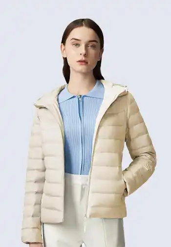 This light beige puffer jacket is a perfect addition to the layered up soccer mom wear. Its quilted design provides warmth and comfort, making it ideal for chilly game days. Pair it with a neutral tee and joggers for a stylish and practical soccer mom outfit.