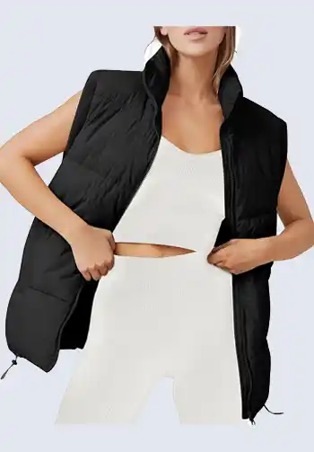 This black quilted puffer vest is a must-have for any soccer mom's wardrobe. Its sleek design and lightweight material provide warmth without bulk, making it perfect for layering. Pair it with a fitted top and leggings for a chic and functional look on the sidelines.