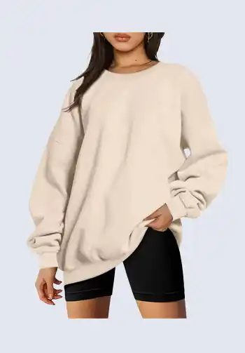 Stay comfortable and stylish with this soft beige oversized sweatshirt, ideal for soccer mom attire. Its neutral color makes it versatile, easily pairing with any leggings or shorts. This sweatshirt ensures you stay warm and chic while cheering from the sidelines.