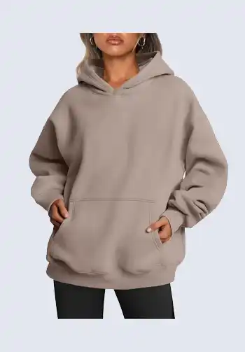 This relaxed taupe oversized hoodie is a must-have for any soccer mom wardrobe. The hoodie provides extra warmth and comfort, making it perfect for chilly mornings on the field. Pair it with your favorite leggings for a functional and stylish soccer mom attire.