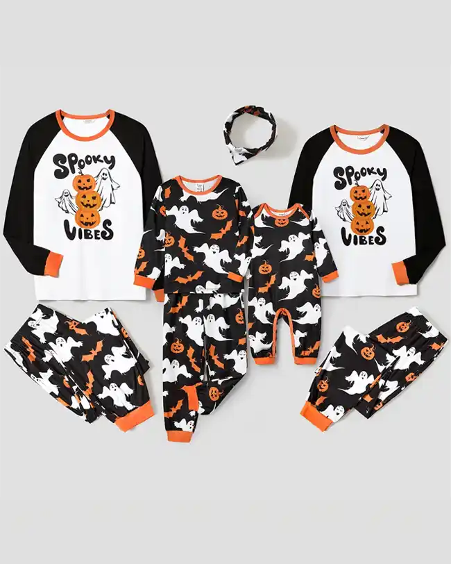 A set of matching family pajamas featuring 'Spooky Vibes' tops and Halloween-themed bottoms with ghosts, pumpkins, and bats, perfect for Halloween celebrations.