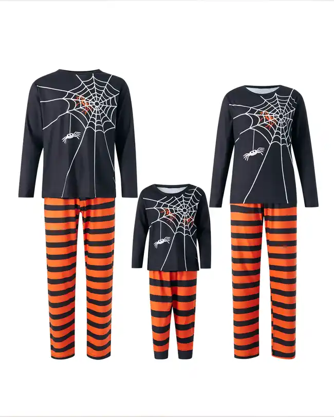 Set of matching Halloween pajamas for the whole family featuring black tops with a white spider web design and orange and black striped pants. The image includes adult and children's sizes, arranged together to showcase the complete set.