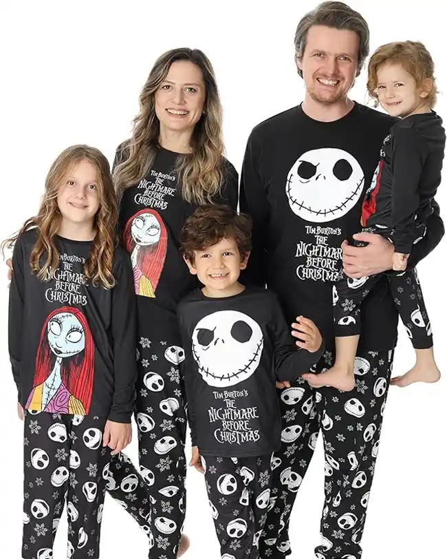 A family dressed in matching Halloween pajamas featuring characters from Tim Burton's 'The Nightmare Before Christmas,' perfect for fans of the classic film and festive Halloween celebrations.