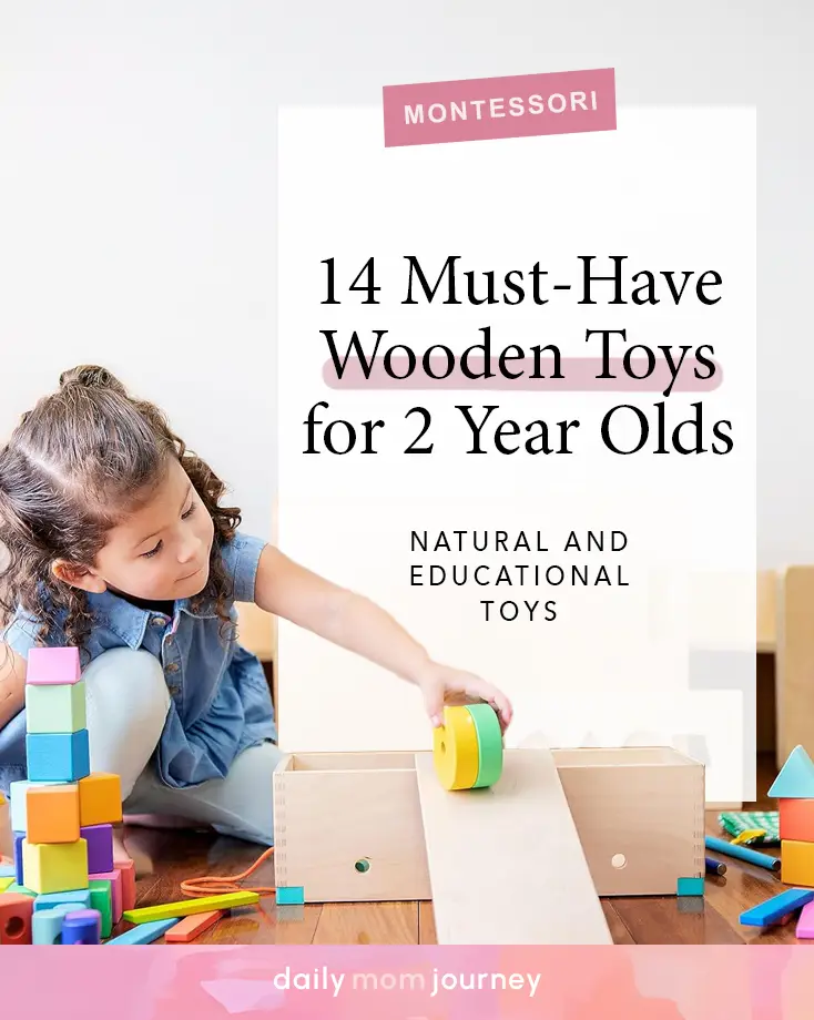 A little girl playing with a wooden ramp and wheel, highlighting the best Montessori wooden toys for 2-year-olds.