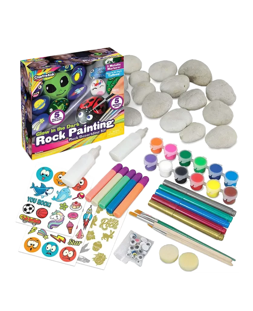 A Creative Kids Glow in the Dark Rock Painting Kit with rocks, paints, brushes, markers, and stickers, perfect for outdoor artistic activities.