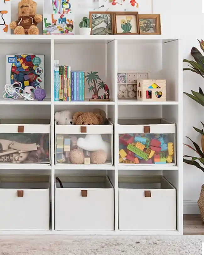 A set of clear-view storage bins with transparent fronts, filled with stuffed animals and folded clothes, providing an organized and visible toy storage solution.