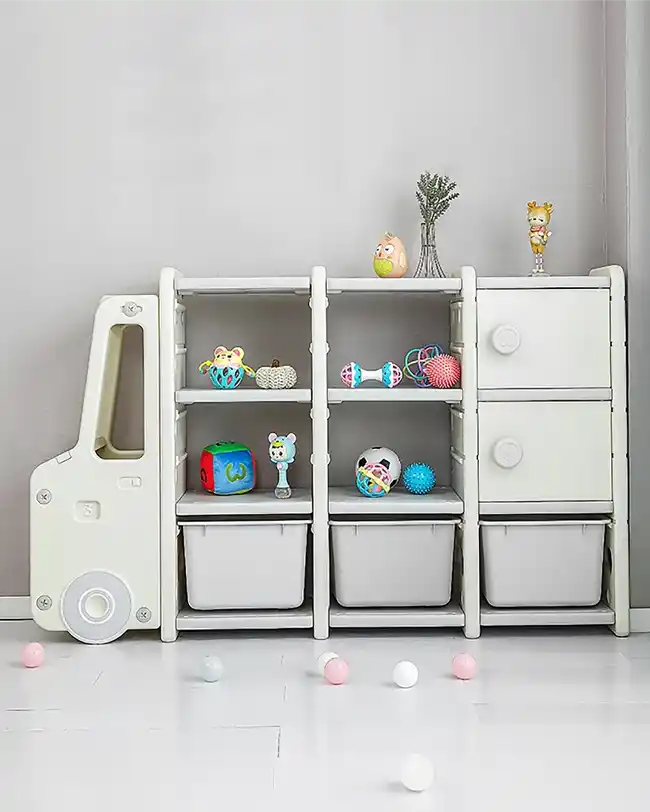 A modular toy storage unit with a combination of open shelves and drawers, filled with various toys, providing a flexible and customizable toy storage solution.