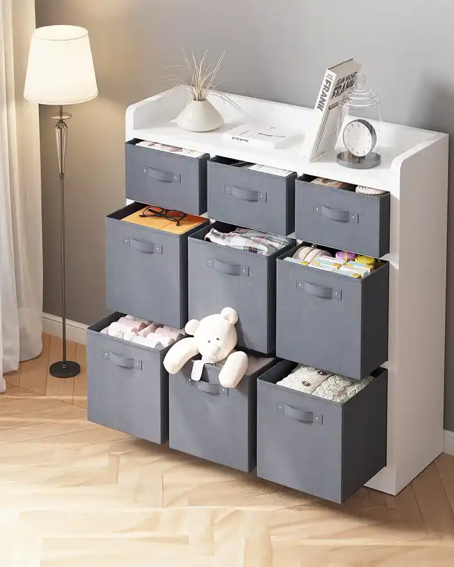 A cube organizer with gray fabric bins, each filled with various toys and items, providing a versatile and stylish toy storage solution.