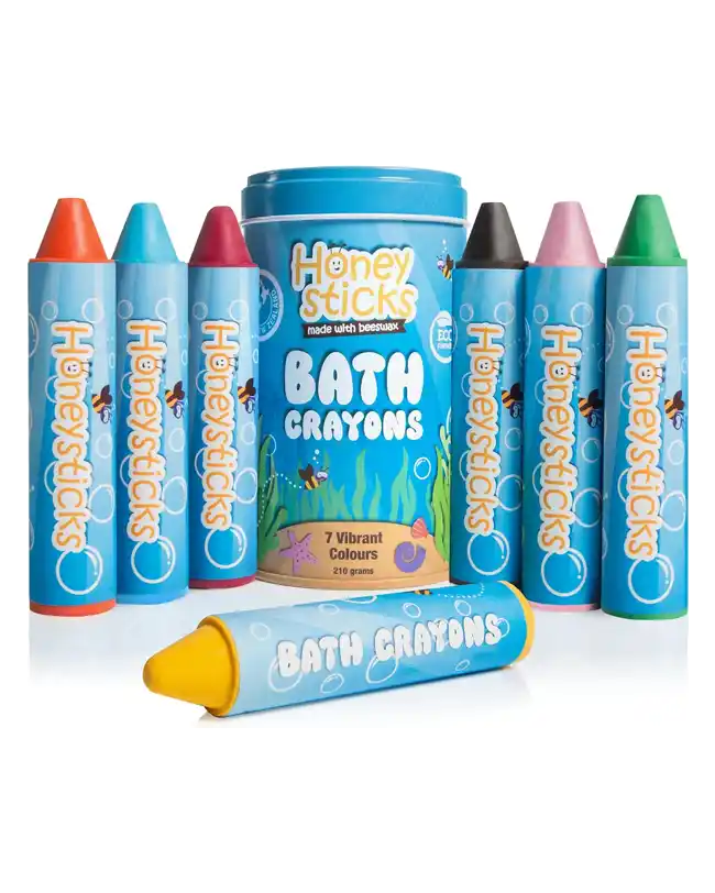 A set of seven vibrant Honeysticks Super Jumbo Bath Crayons made from non-toxic beeswax, designed for drawing on bath walls. The set includes colors like red, orange, yellow, green, blue, purple, and black.