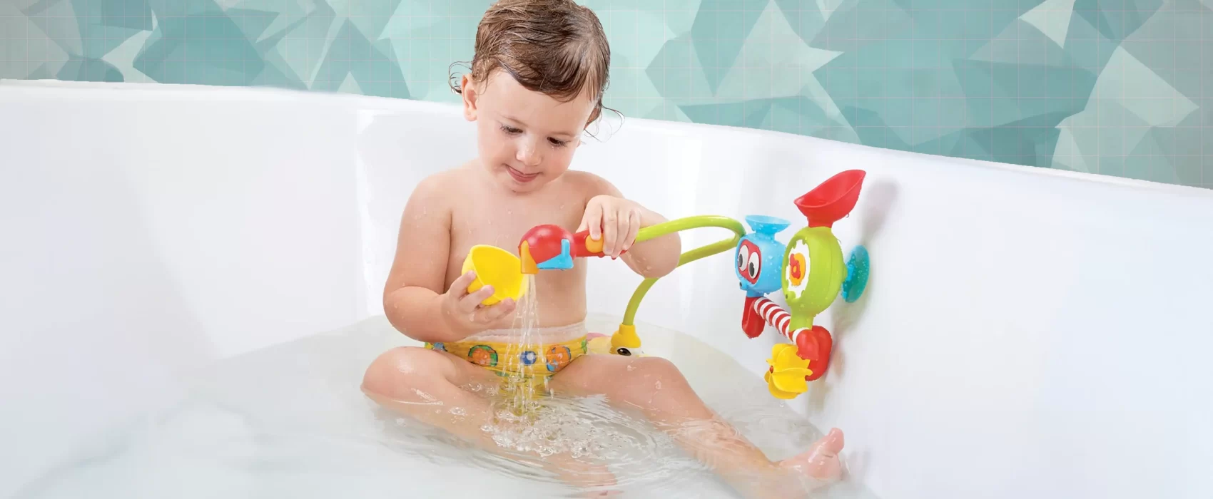 A young child enjoying bath time with interactive baby bath toys, featuring a colorful and engaging toy setup that makes bath time playful and entertaining.