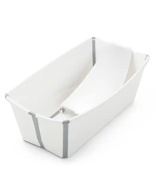 The Stokke Flexi Bath showcasing its foldable design and included newborn support insert, highlighting its versatility as a baby bath tub.