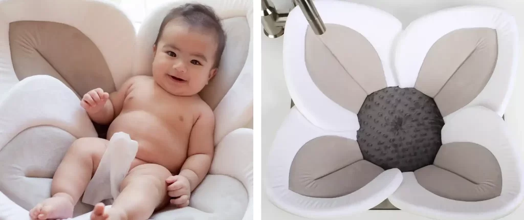  A baby being bathed in the Blooming Bath Lotus, showing the baby comfortably laying in the soft, flower-shaped baby bath tub.