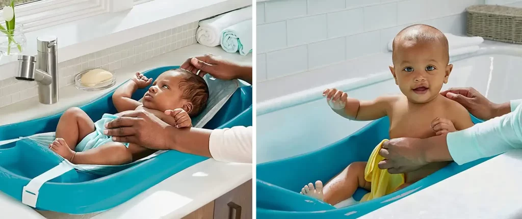 A baby being bathed in The First Years Sure Comfort Deluxe baby bath tub, showing the baby comfortably laying in the tub with parental support.