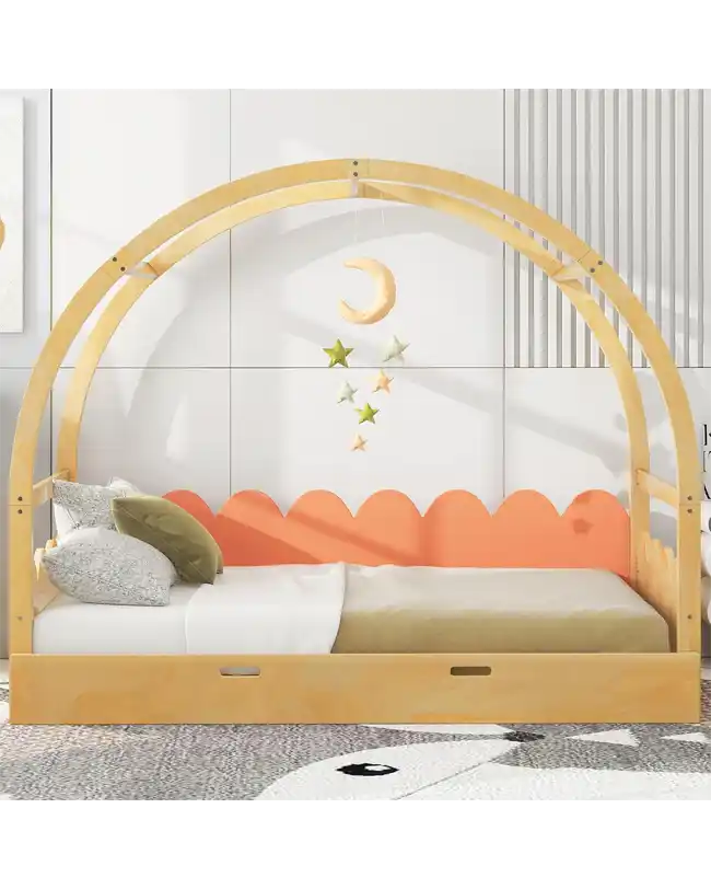 A stylish Montessori floor bed featuring a vaulted canopy frame made of natural wood. The toddler floor bed has a low profile, encouraging independence and self-reliance. The bed's design includes a colorful, scalloped headboard and a cozy setup with pillows and soft bedding. Hanging star and moon decorations add a whimsical touch, creating a magical and inviting sleep environment for young children.