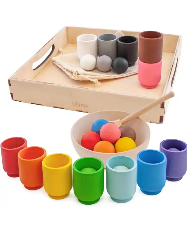 Colorful wooden balls and cups used for sorting and categorizing, ideal for developing cognitive skills and fine motor skills in 1 year olds.