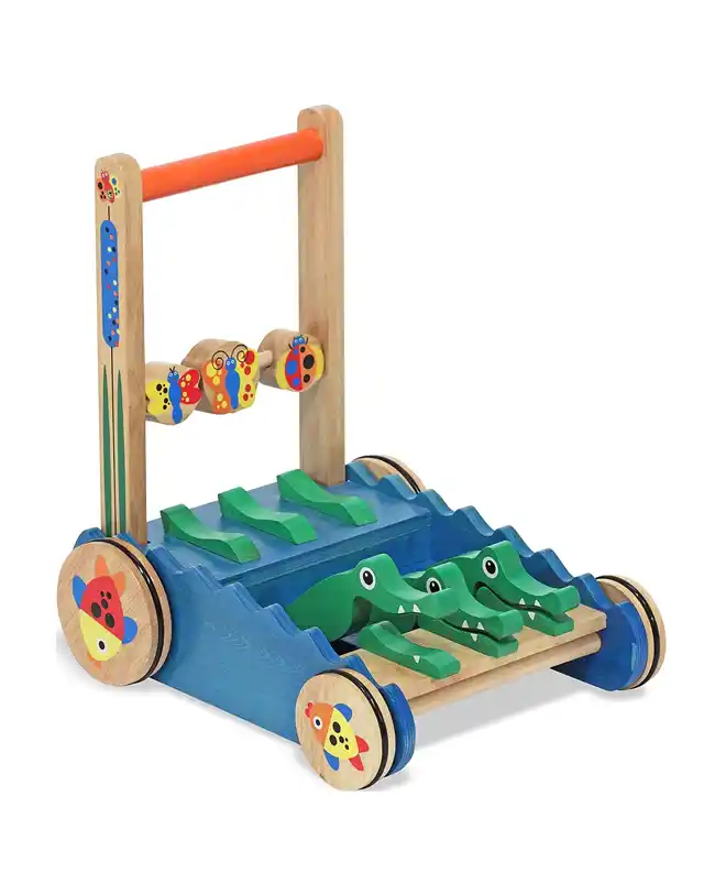 A wooden alligator push toy, helping toddlers with their first steps while promoting gross motor skills, perfect for Montessori toys for 1 year olds.